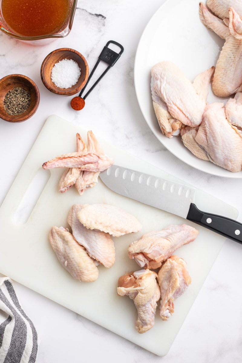 chicken wings and knife showing how to trim