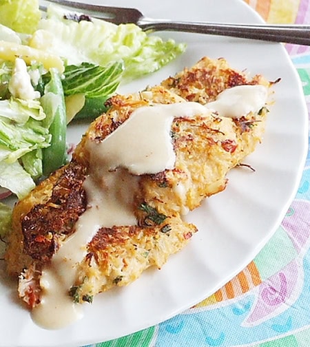 crab cakes on a plate with salad