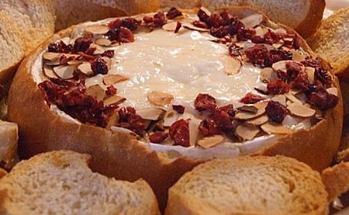 Baked Brie with sliced almonds and cranberries