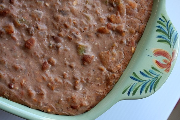 green baking dish with Mexican Bean Dip