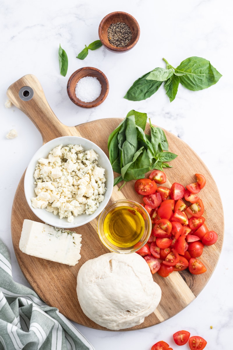 ingredients displayed for making pizzette with gorgonzola tomato and basil