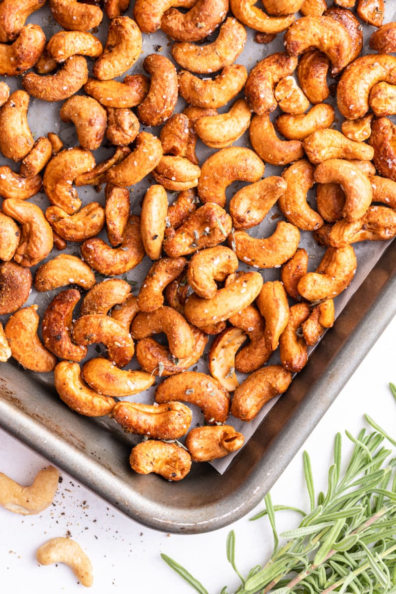 rosemary maple cashews on a baking sheet