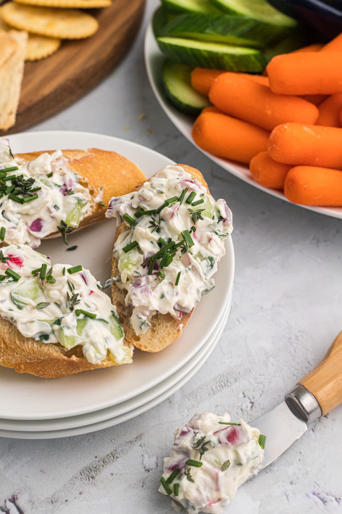 vegetable goat cheese spread on baguette slices