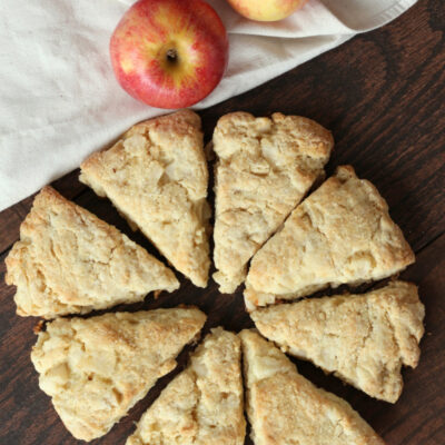 overhead shot of apple cream scones with three fresh apples