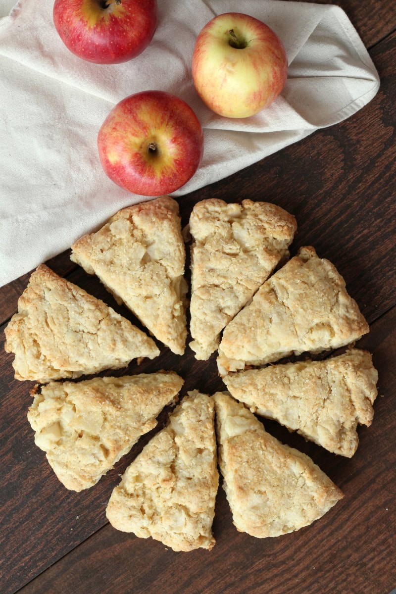 overhead shot of apple cream scones with three fresh apples