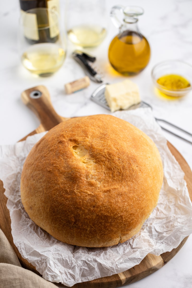 round loaf of bread on cutting board