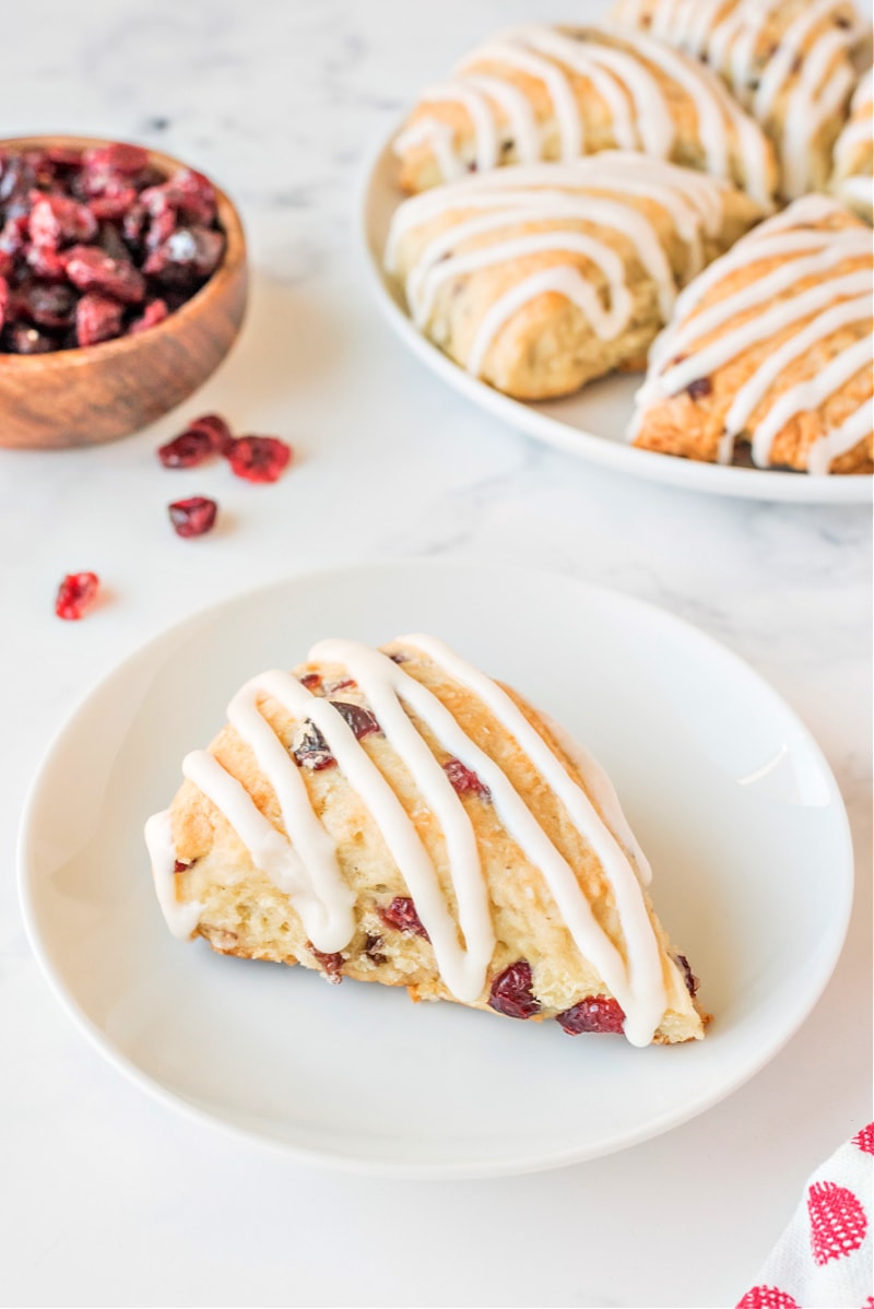 cranberry vanilla scone on a white plate