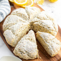 lemon poppyseed scones on a board pulled apart