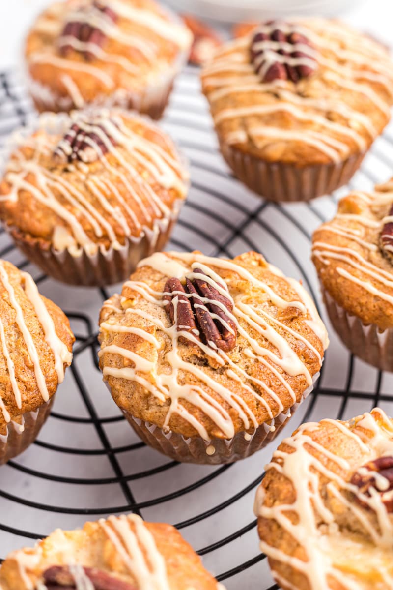 maple drizzled apple muffins on a rack