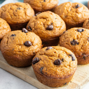 pumpkin chocolate chip muffins on a cutting board