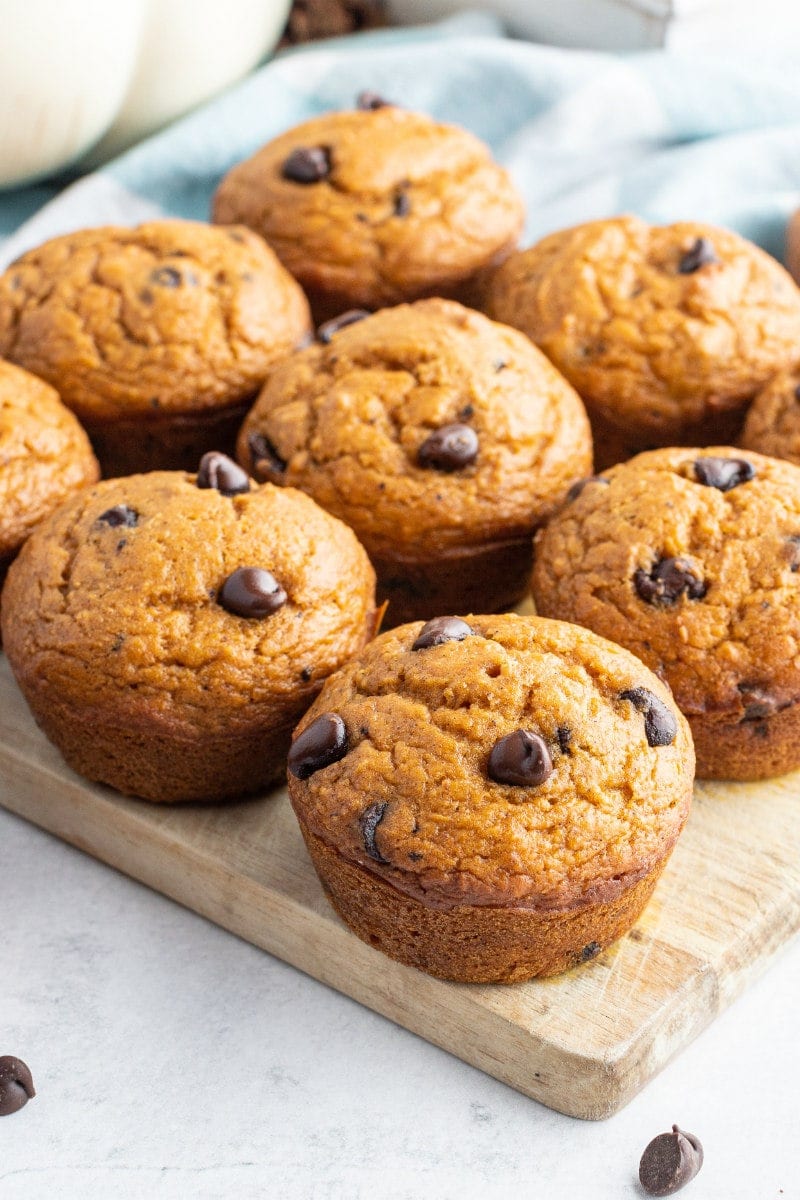 pumpkin chocolate chip muffins on a cutting board