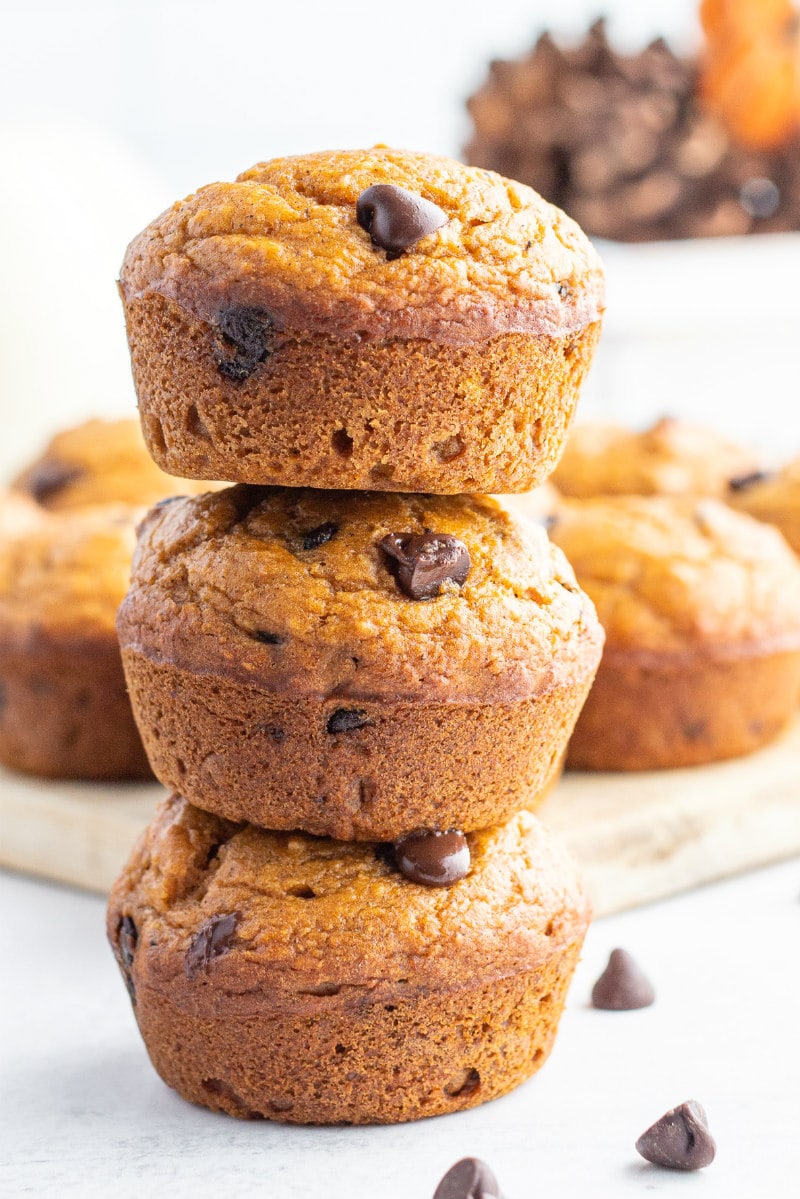 three stacked pumpkin chocolate chip muffins