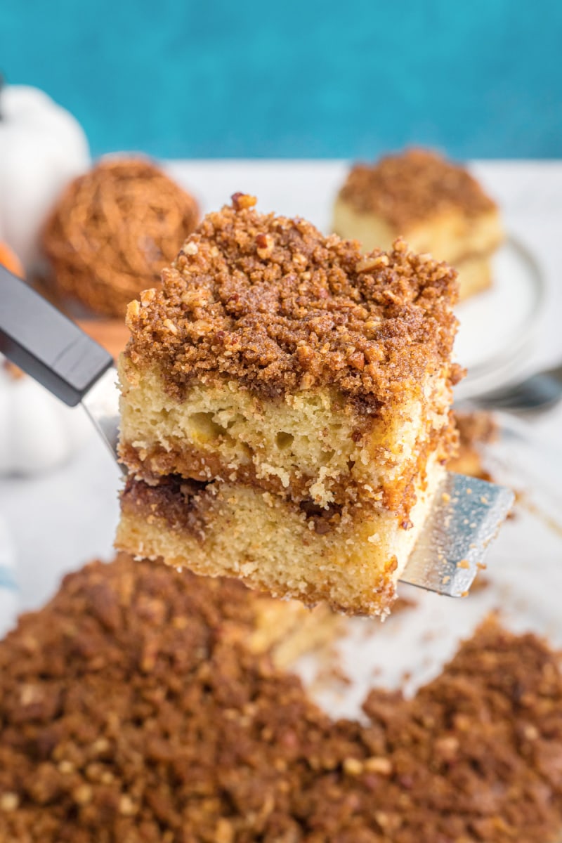 spatula lifting slice of coffee cake out of pan