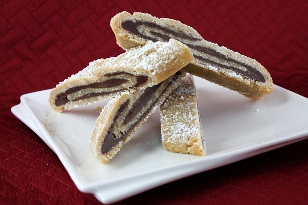 Bake and Slice Chocolate Swirls on a white serving dish with a burgundy background