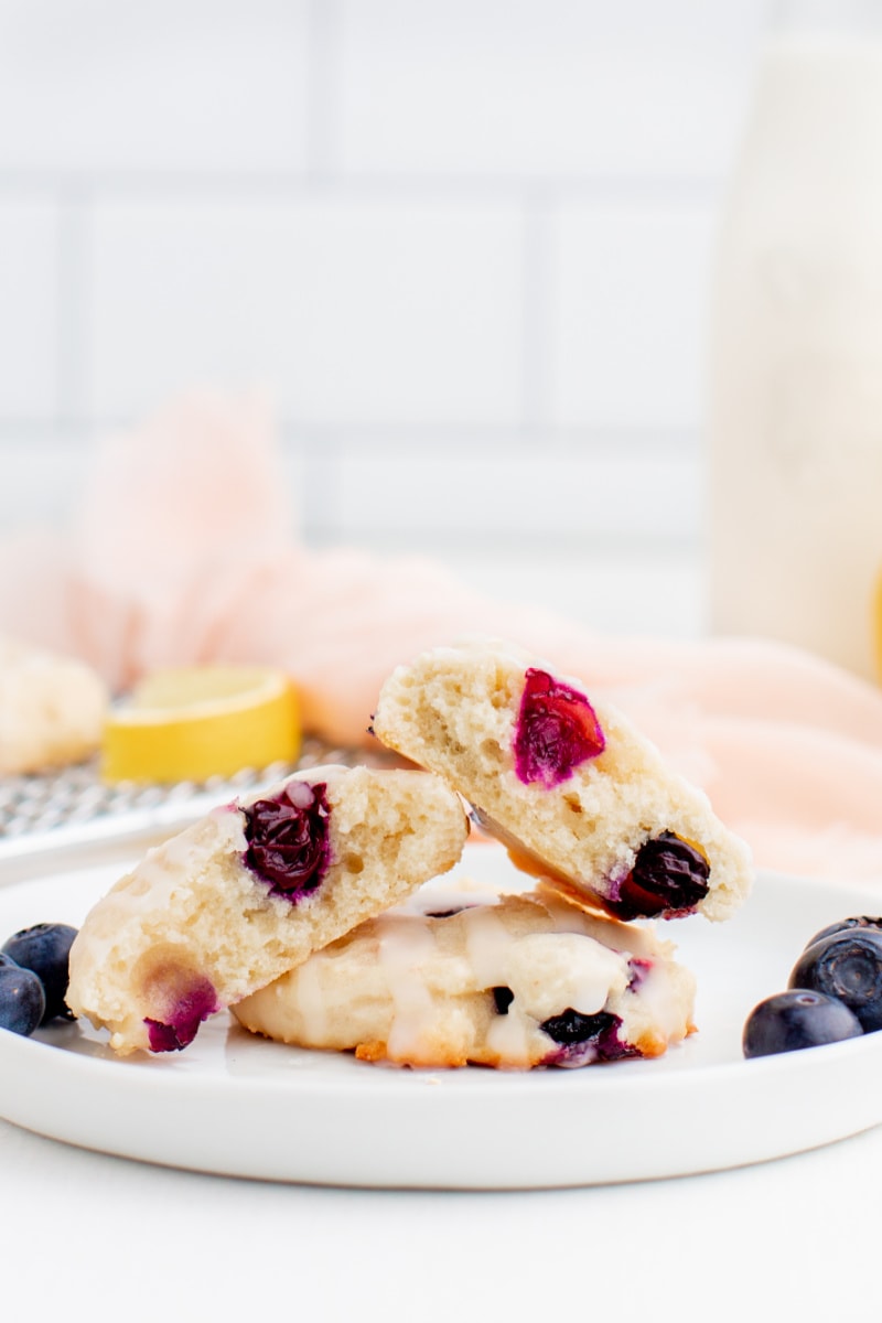 blueberry cookies on a white plate broken in half