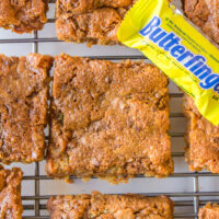 butterfinger blondies on a cooling rack with mini butterfingers
