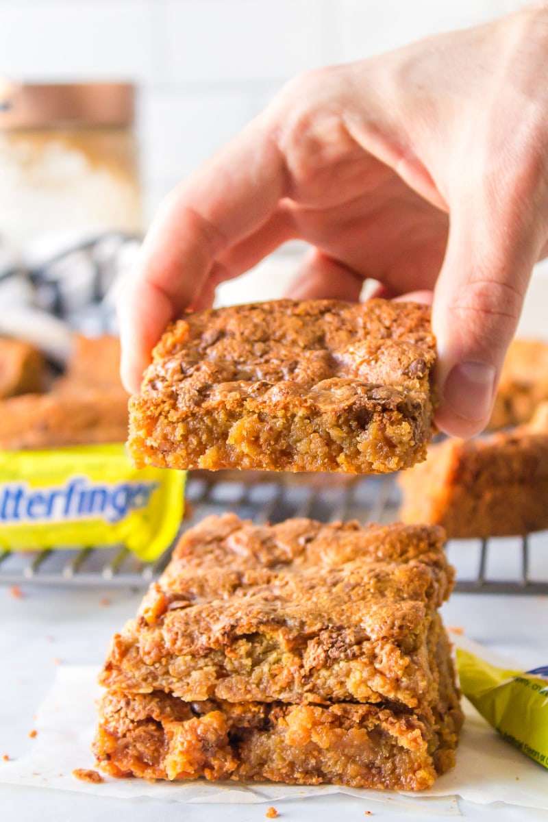 hand picking up butterfinger blondie