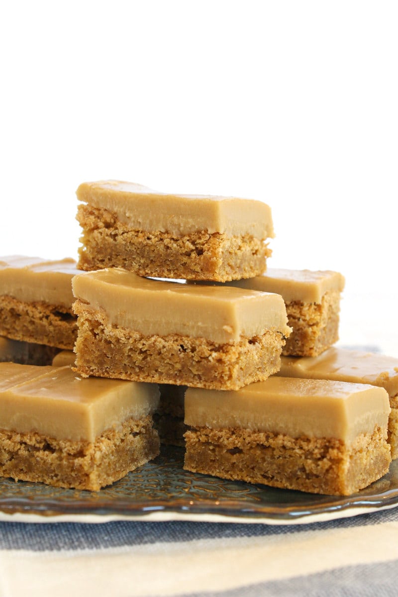 butterscotch brownies stacked on a grey plate