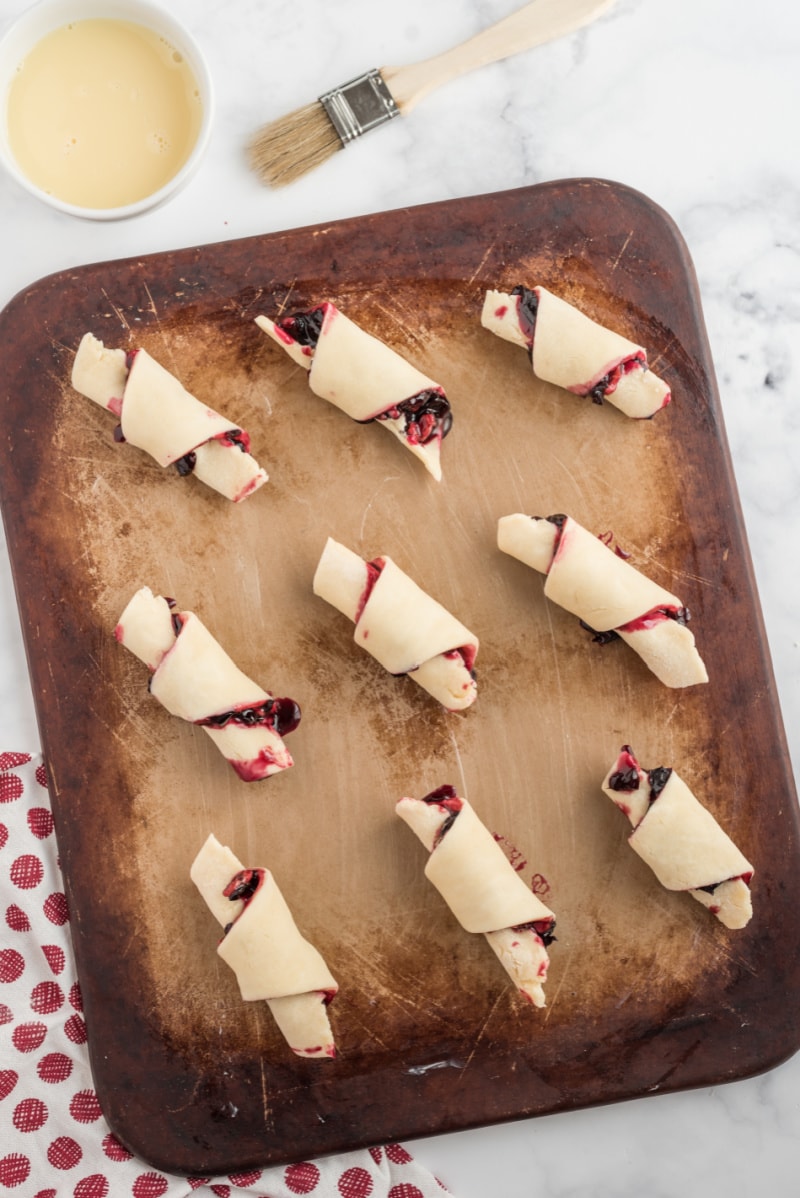 cherry rugelach on a baking sheet