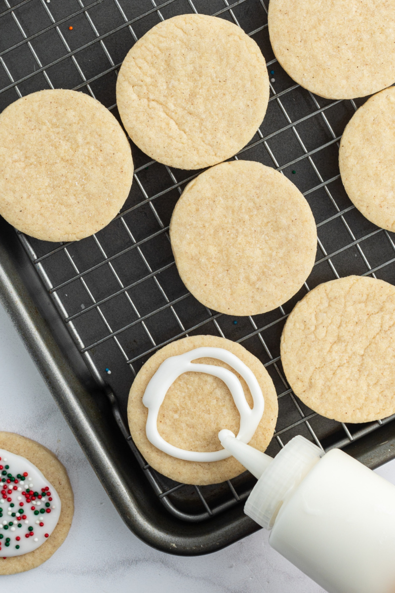 adding icing to cinnamon sugar cookies