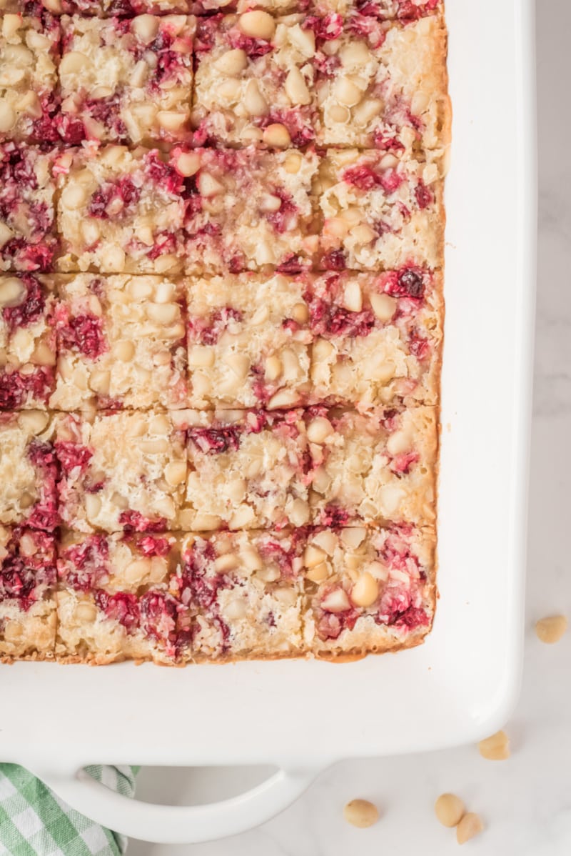 cranberry macadamia bars cut into pieces in pan