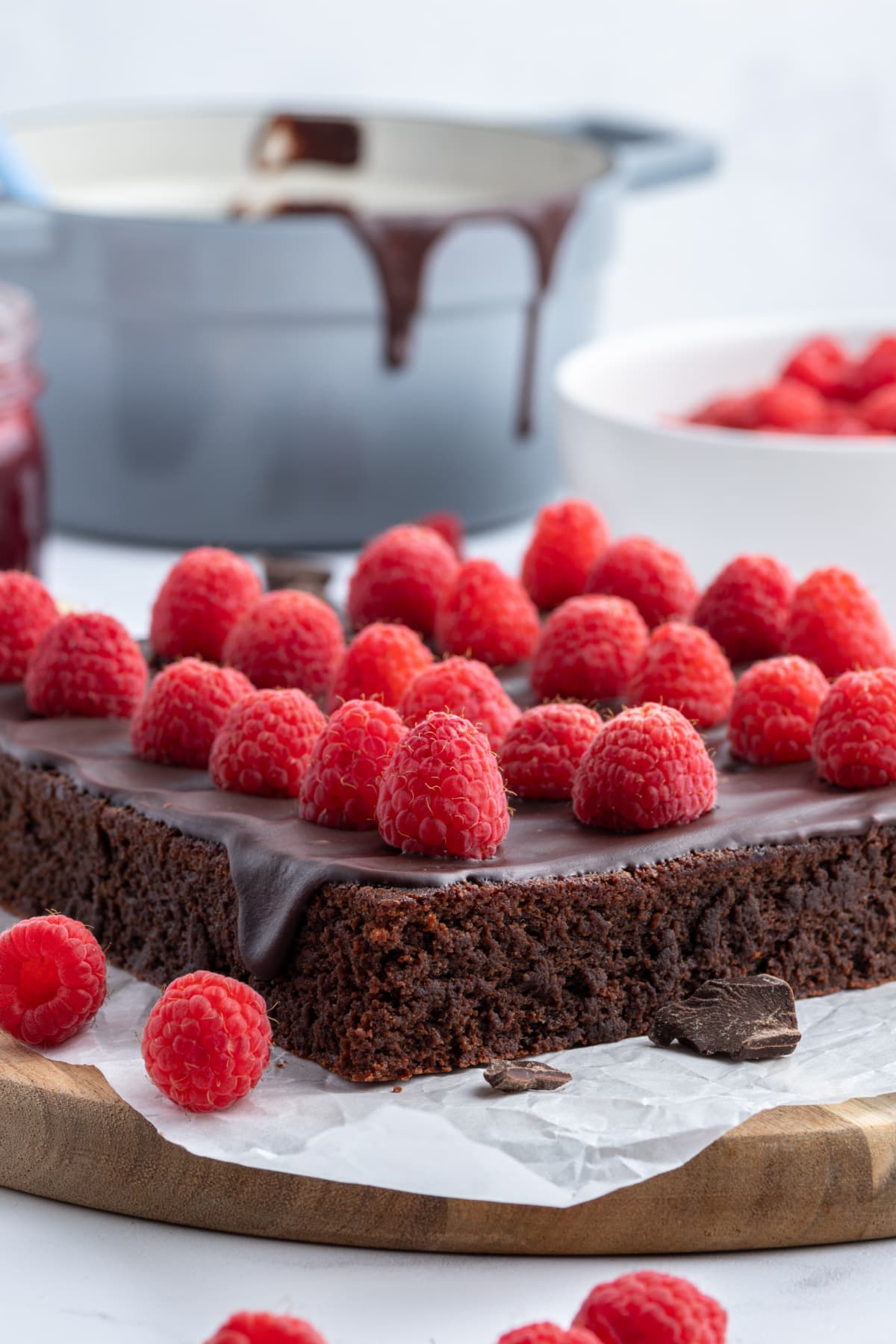 side view of chunk of fudgy chocolate raspberry bar before being cut