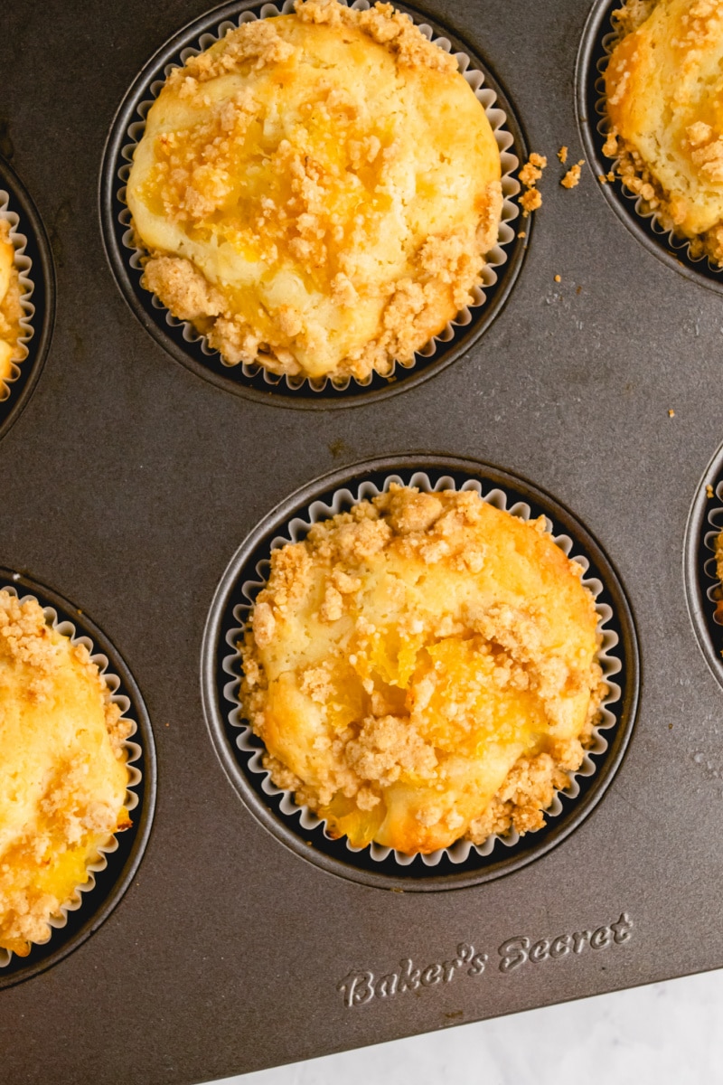 overhead shot of pineapple muffins in muffin pan