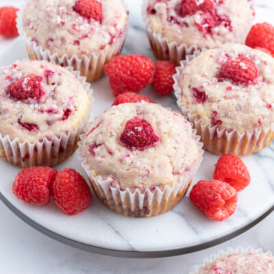 sugar crusted raspberry muffins on a serving tray