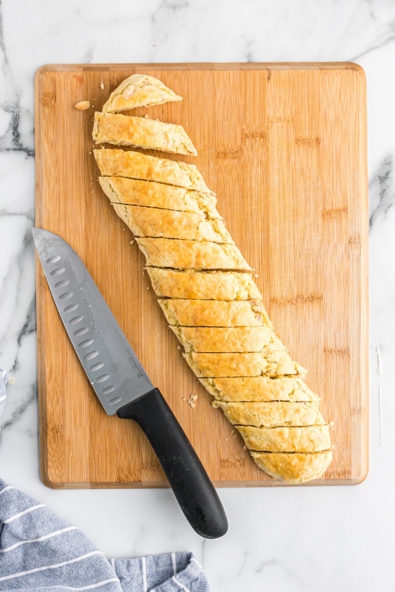 biscotti log sliced on a cutting board