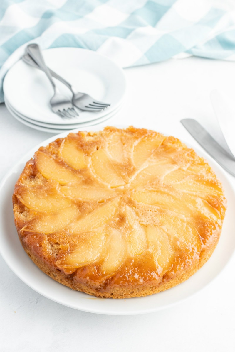 apple upside down cake on white platter