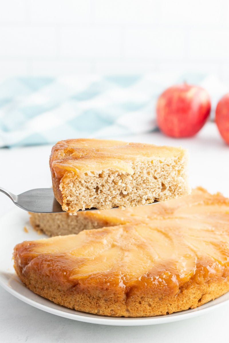 serving slices of upside down apple cake