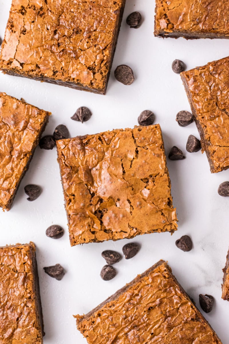 overhead shot of brownie squares and scattered chocolate chips