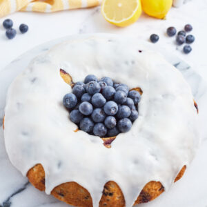 pinterest image for blueberry cake with lemon buttercream
