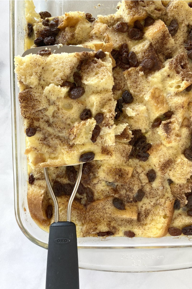 Using a spatula to serve Classic Bread Pudding