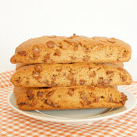 three pieces of brown sugar cinnamon biscotti on a plate