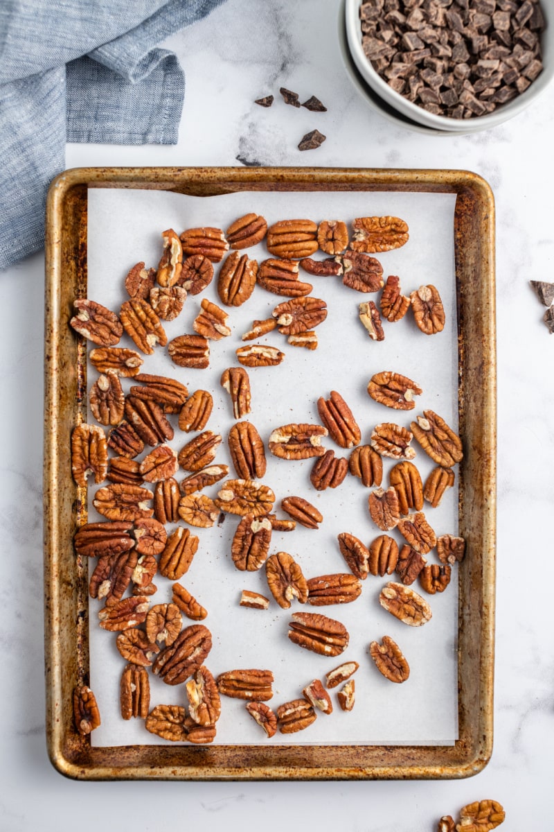 toasting pecans on a baking sheet