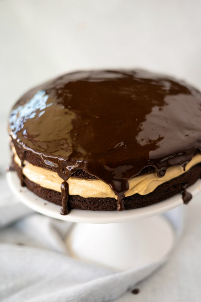 adding chocolate glaze to Chocolate Harvest Cake