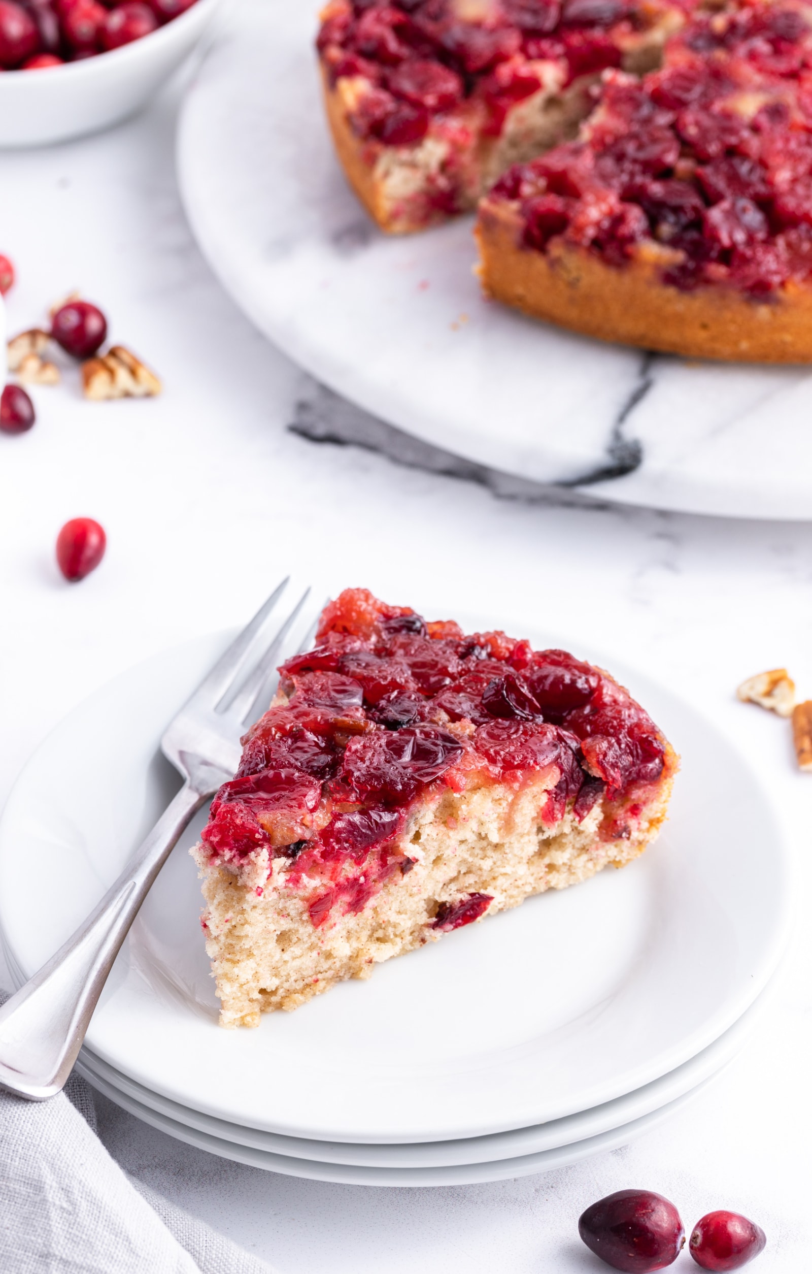 slice of cranberry upside down cake on plate