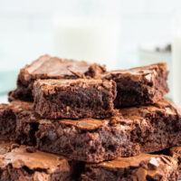 stack of brownies displayed on white platter