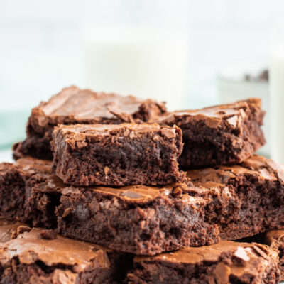 stack of brownies displayed on white platter