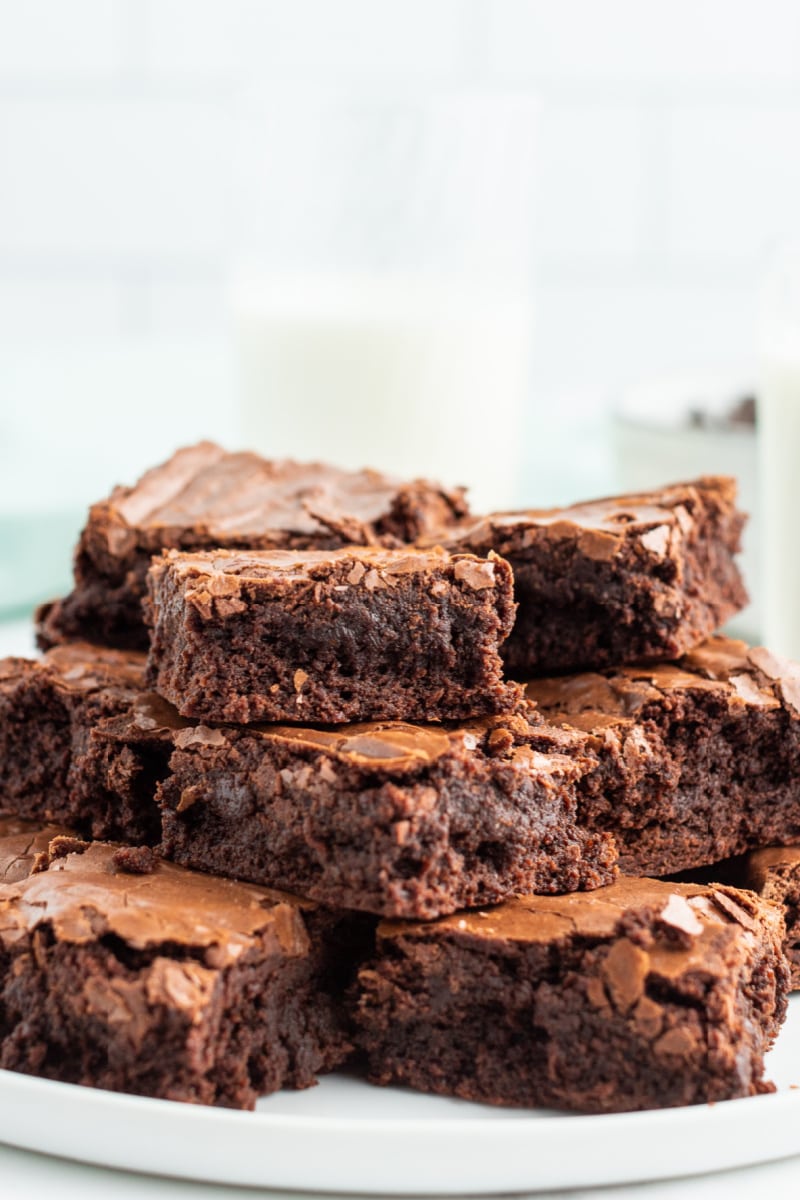 stack of brownies displayed on white platter