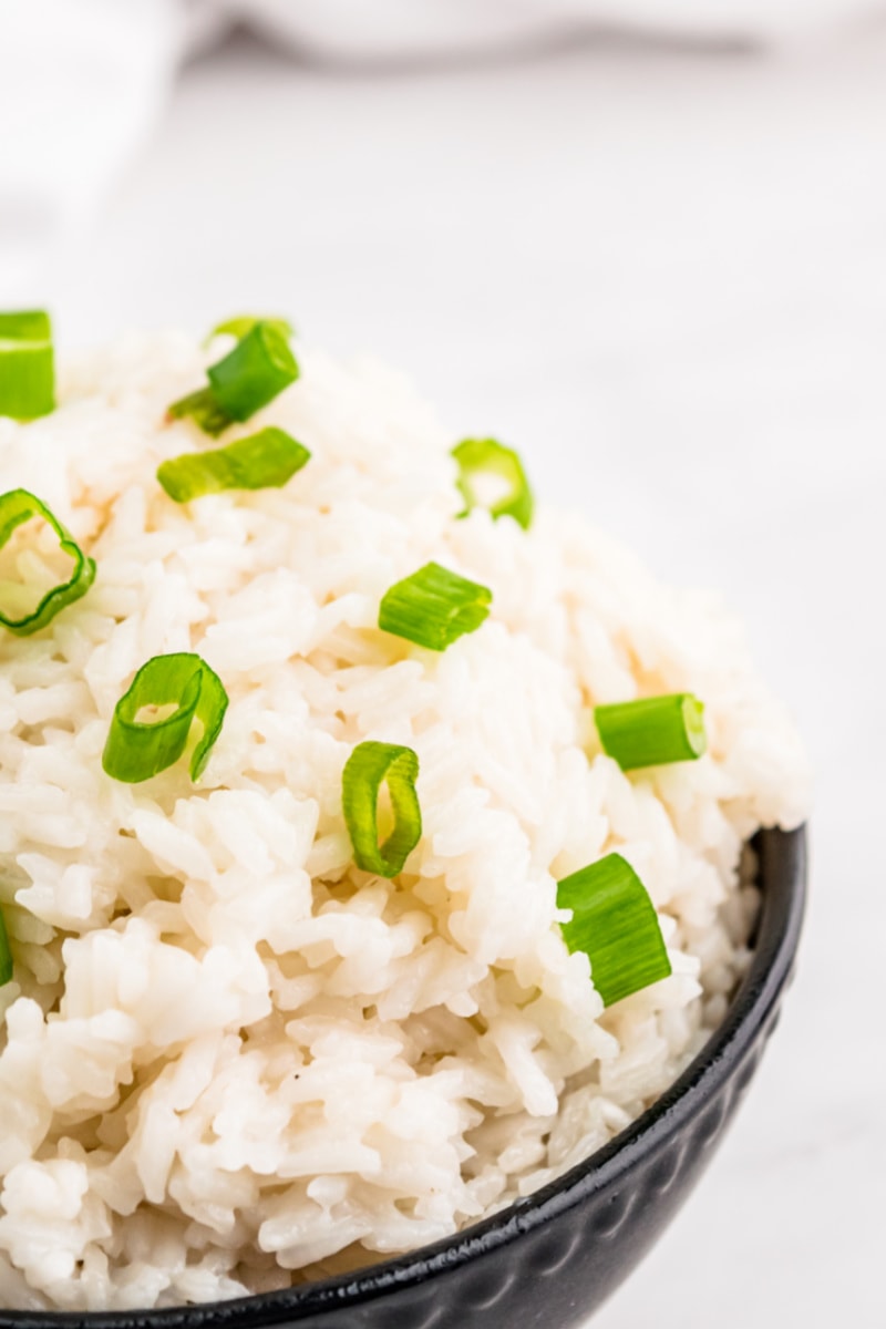 Easy Coconut Rice recipe from RecipeGirl.com #easy #coconut #rice #recipe #RecipeGirl coconut rice with green onion garnish