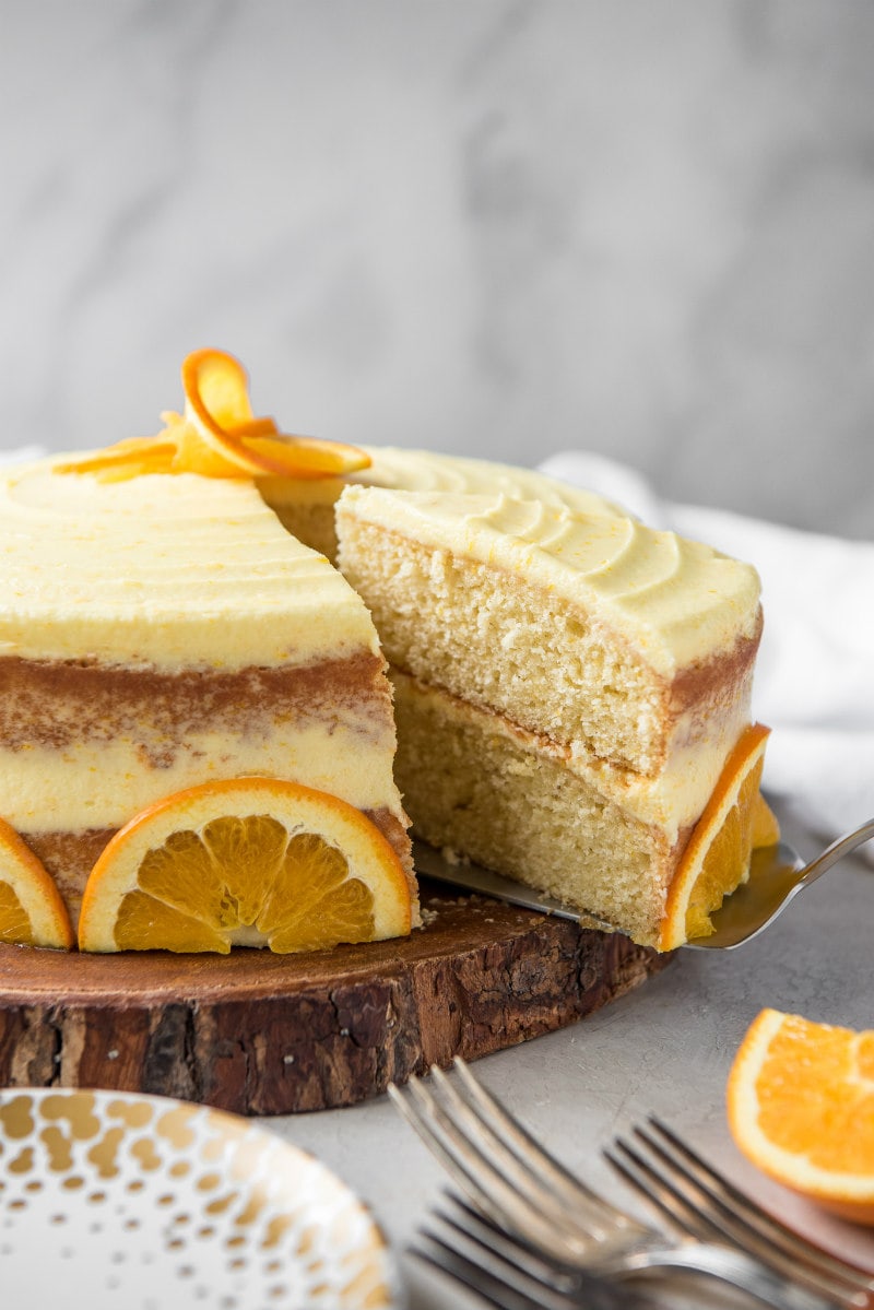 serving fresh orange layer cake