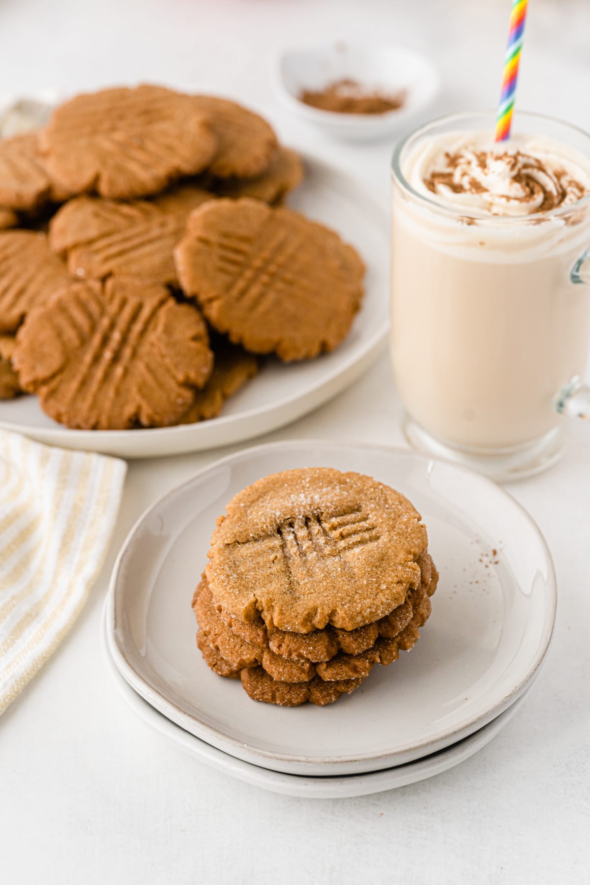 ginger cookies on a plate with platter of cookies in background