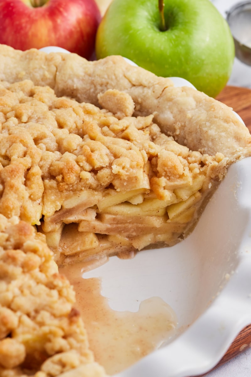 apple pie with slice cut out of it