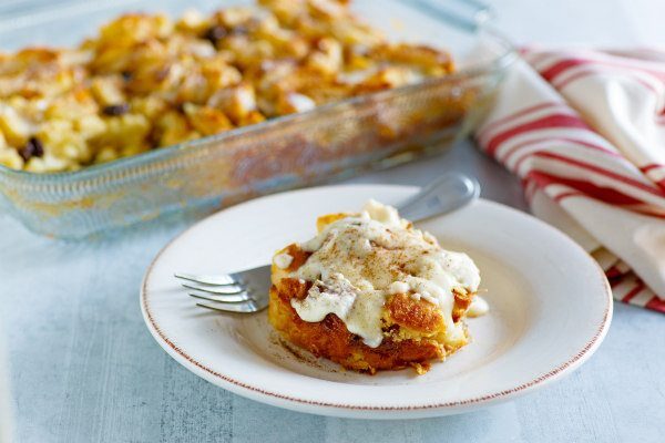Irish Bread Pudding recipe from RecipeGirl.com #irish #bread #pudding #recipe #RecipeGirl slice of Irish Bread Pudding with caramel whiskey Sauce