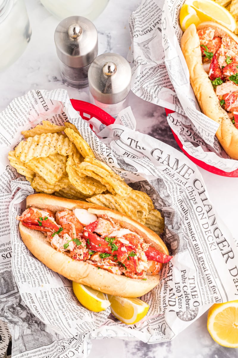 lobster rolls in paper lined baskets with chips