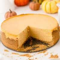 low fat pumpkin cheesecake with a big slice taken out of it