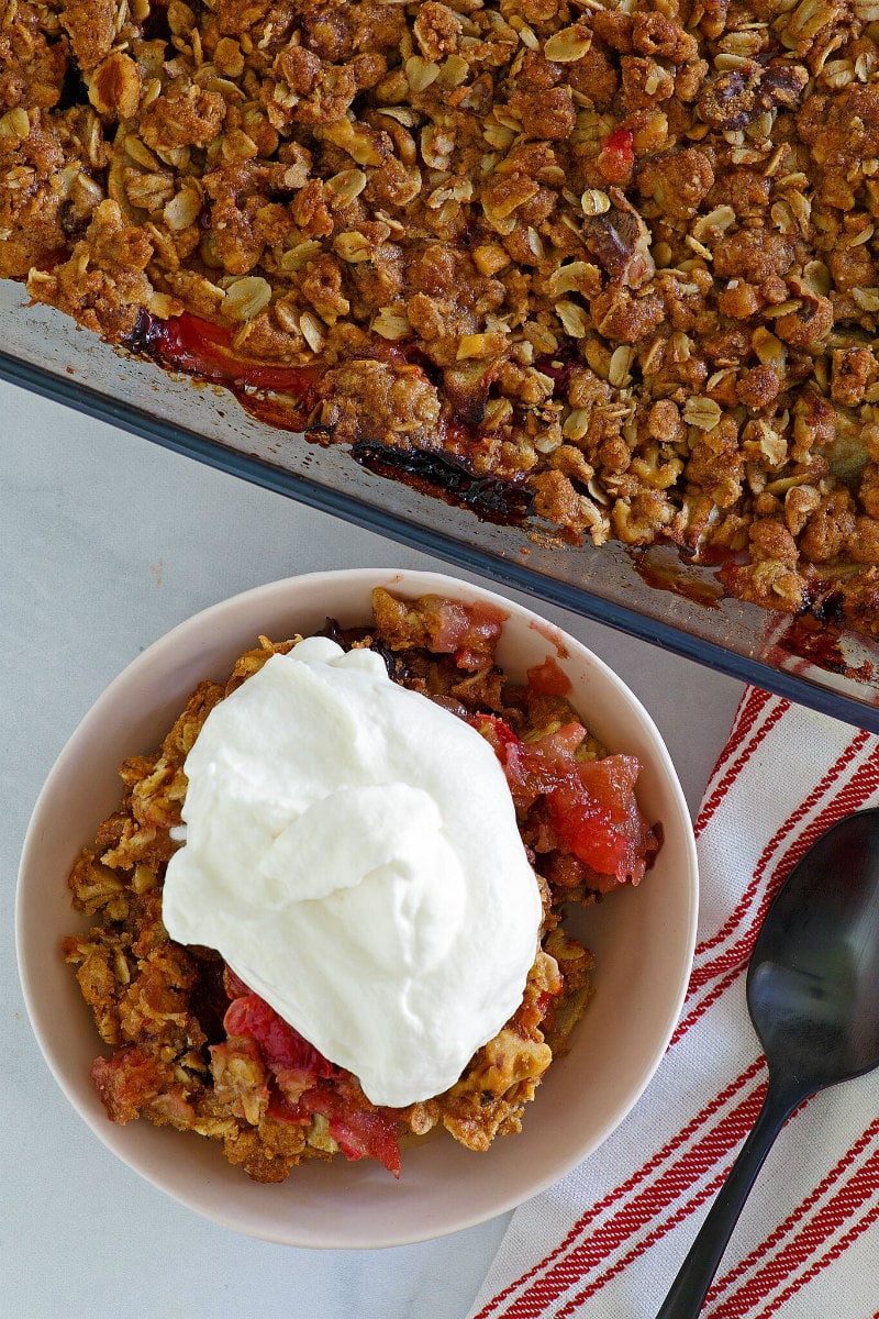 Serving Apple Cranberry Crisp with Maple Whipped Cream