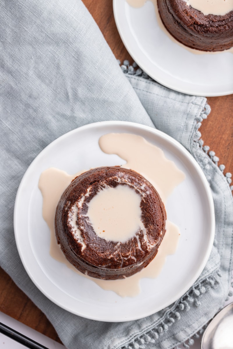 irish cream poured on top of molten chocolate cake on plate